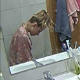 A hidden camera is positioned to record the reflection in the bathroom mirror of an attractive blonde girl taking a wet, gassy shit while sitting on a toilet in 2 scenes. Audio is fairly clear. Vertical format video. Over 7 minutes.